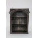 A Victorian stained pine set of open wall shelves with moulded arched cornice, fitted two shelves,