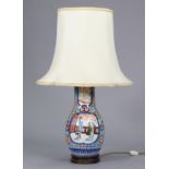 A 20th century Japanese porcelain baluster vase table lamp with figure scene & floral decoration, on