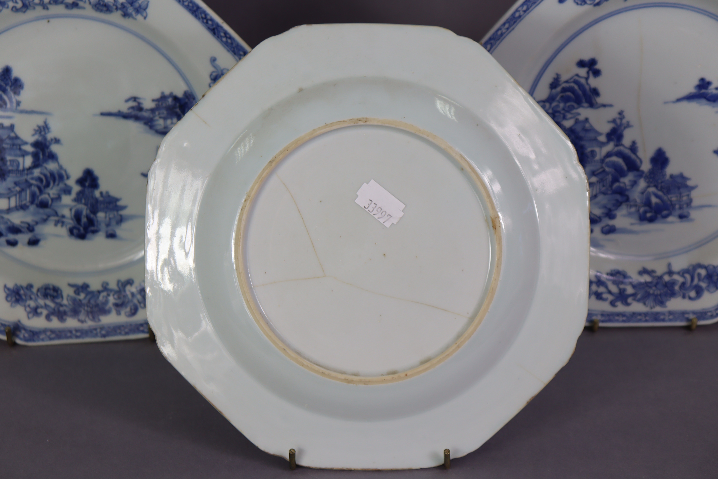 A set of three 18th century Chinese blue & white porcelain octagonal plates, each with a river - Image 5 of 5