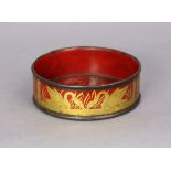 A Regency red-lacquered papier mâché wine coaster, with gilt decoration of swans & foliage between