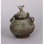 An early 20th century Indian Dhokra-work cast brass jar & cover with peacock handle, 5?” high x