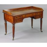 A Victorian mahogany writing table with moulded edge to the rectangular tray-top, fitted with an