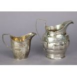 A George III silver milk jug with fluted band around the centre, 4¼”, London 1800 by Solomon Hougham