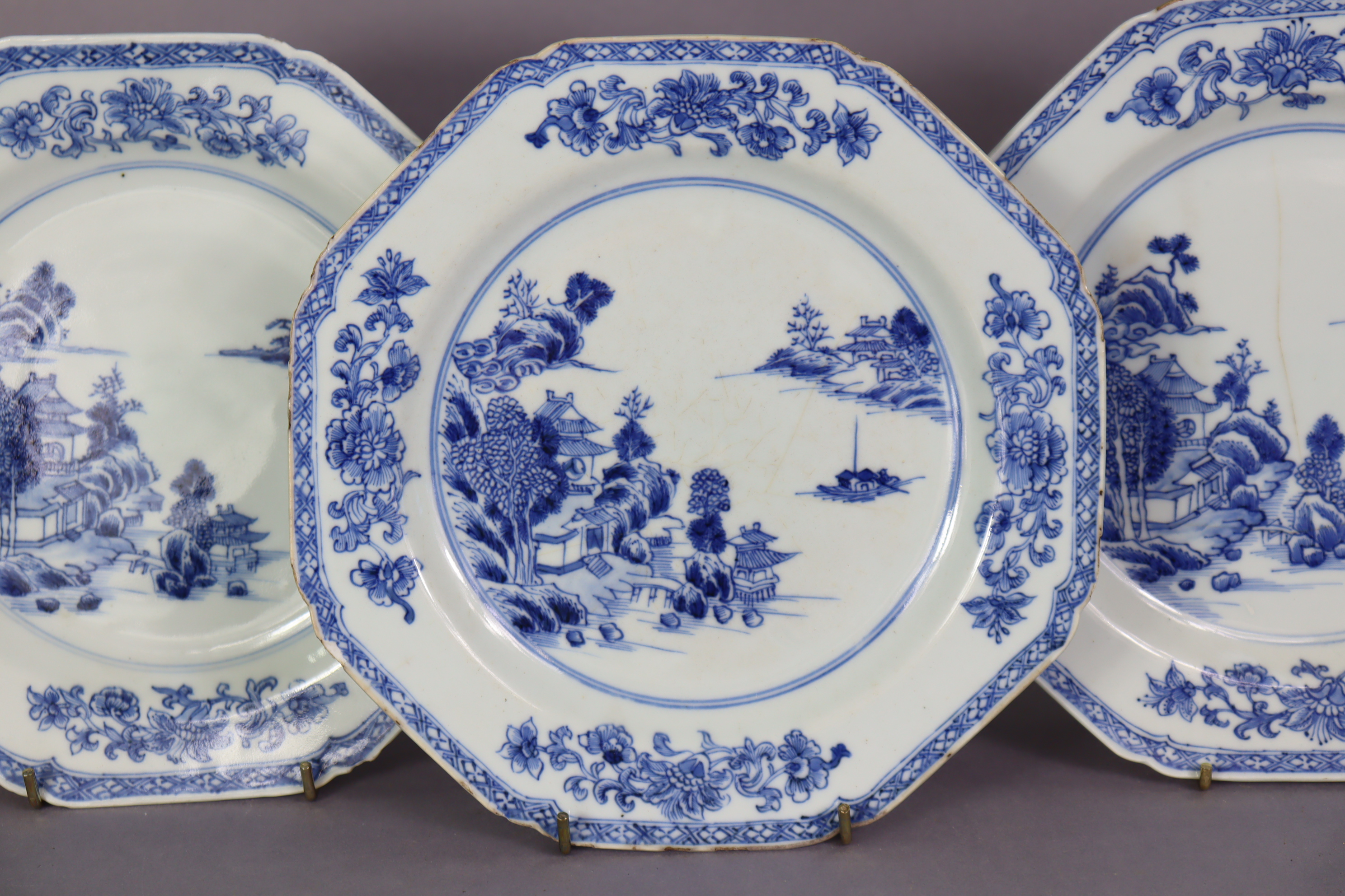 A set of three 18th century Chinese blue & white porcelain octagonal plates, each with a river - Image 4 of 5