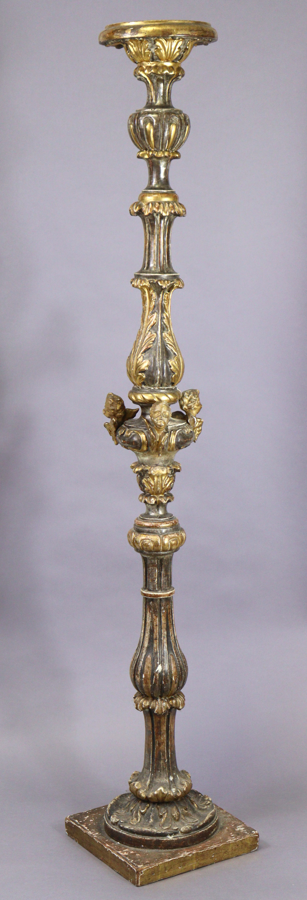 A 19th century Venetian gilt & silvered softwood torchere, the baluster column carved with