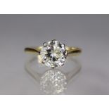 A diamond solitaire, the round-cut stone approx. 2.3 carats, claw-set to an 18ct. gold shank; size: