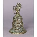 A Flemish bronze table bell, the handle cast in the form of a lion holding heraldic shield, with