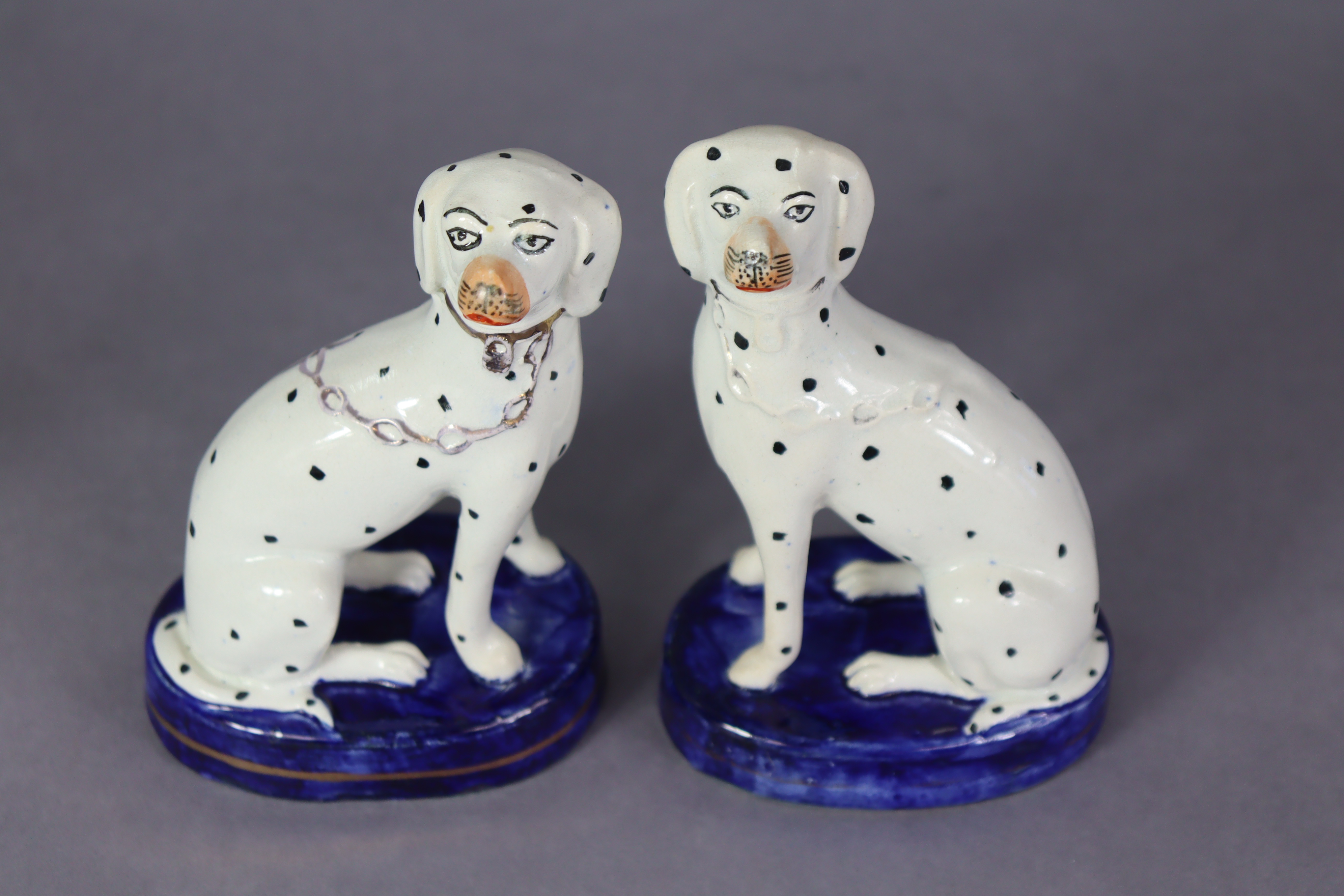 A pair of 19th century Staffordshire pottery models of spaniels, each seated on blue oval base - Image 2 of 4