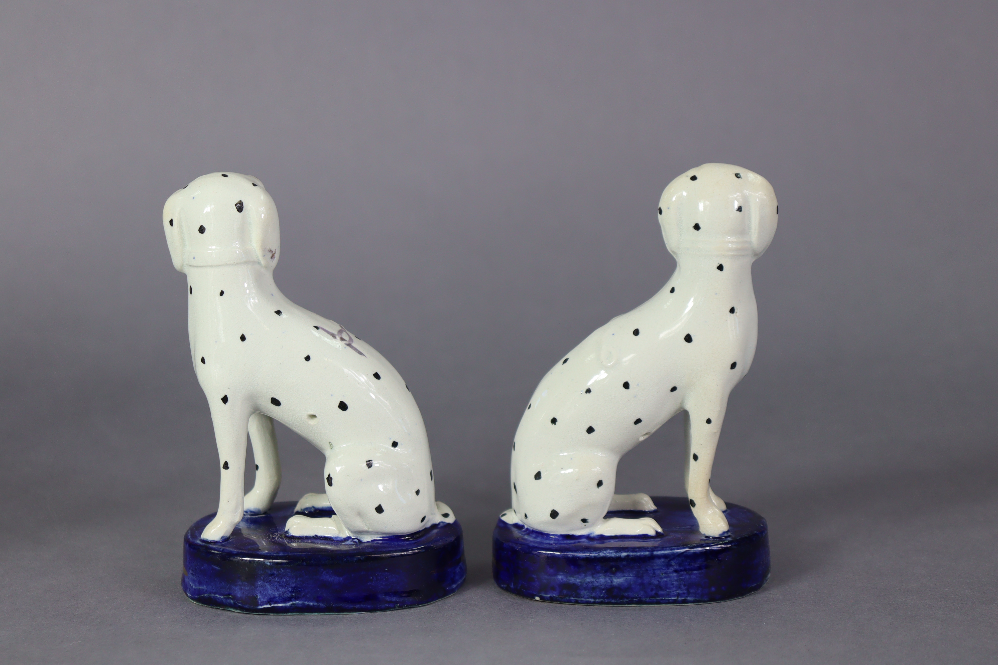 A pair of 19th century Staffordshire pottery models of spaniels, each seated on blue oval base - Image 3 of 4