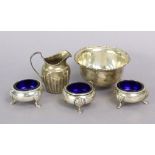 Three matching Victorian silver salts, each with blue glass liners & on three pad feet, Exeter