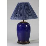 A 20th century Chinese porcelain blue-glazed ovoid vase table lamp on hardwood stand, 27” high