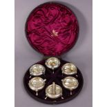 A set of six Victorian silver salt cellars of compressed round form, with beaded rims, each on three