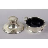 A George V silver circular two-handled butter dish with tapered sides & blue glass liner, 4”