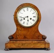 A Victorian burr-walnut mantel clock in balloon-shaped case with applied foliate roundels, on plinth