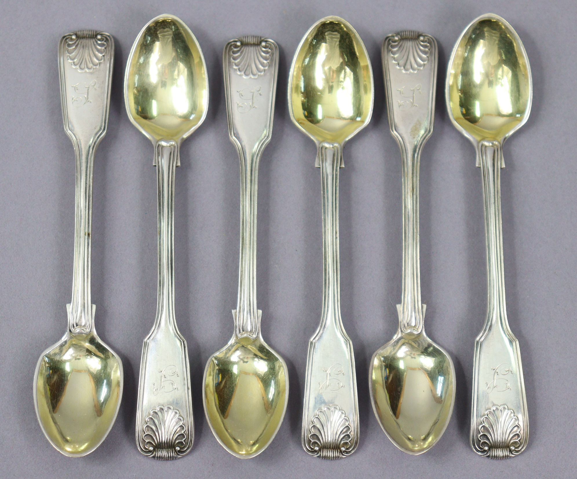 A set of six Victorian silver fiddle, thread, & shell pattern egg spoons; London 1853, by S. Hayne &