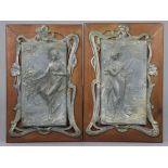 A pair of Arts & Crafts embossed pewter rectangular panels, depicting ta maiden picking grapes,