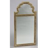 A reproduction Queen Anne-style rectangular wall mirror, with ‘foxed’ mirrored border, 37½” x 19”.