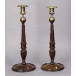 A pair of George III mahogany candlesticks with reeded tapered columns, cast gilt-brass foliate