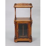 A Victorian walnut sheet music cabinet, the upper tier with a pierced gallery, on lier-shaped