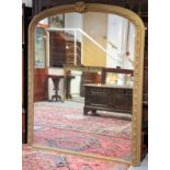A late Victorian large wall mirror in a gilt-painted frame with ribbon-leaf decoration with