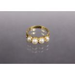 A 19th century 18ct gold ring set row of four graduated split pearls; size: N. (3.1 gm).