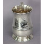 A George II silver baluster mug with reeded band to the lower part, acanthus scroll handle, engraved
