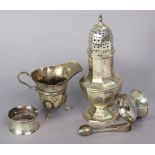 A George V silver sugar caster of octagonal baluster shape, 6¾” high, Sheffield 1938, by E. Viner (