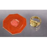 An 18ct. gold signet ring with engraved crest, Birmingham hallmarks for 1958; size: H/J; 8.4 gm;