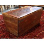 A 20th century South African hardwood trunk of tapered rectangular form, with hinged lift lid,