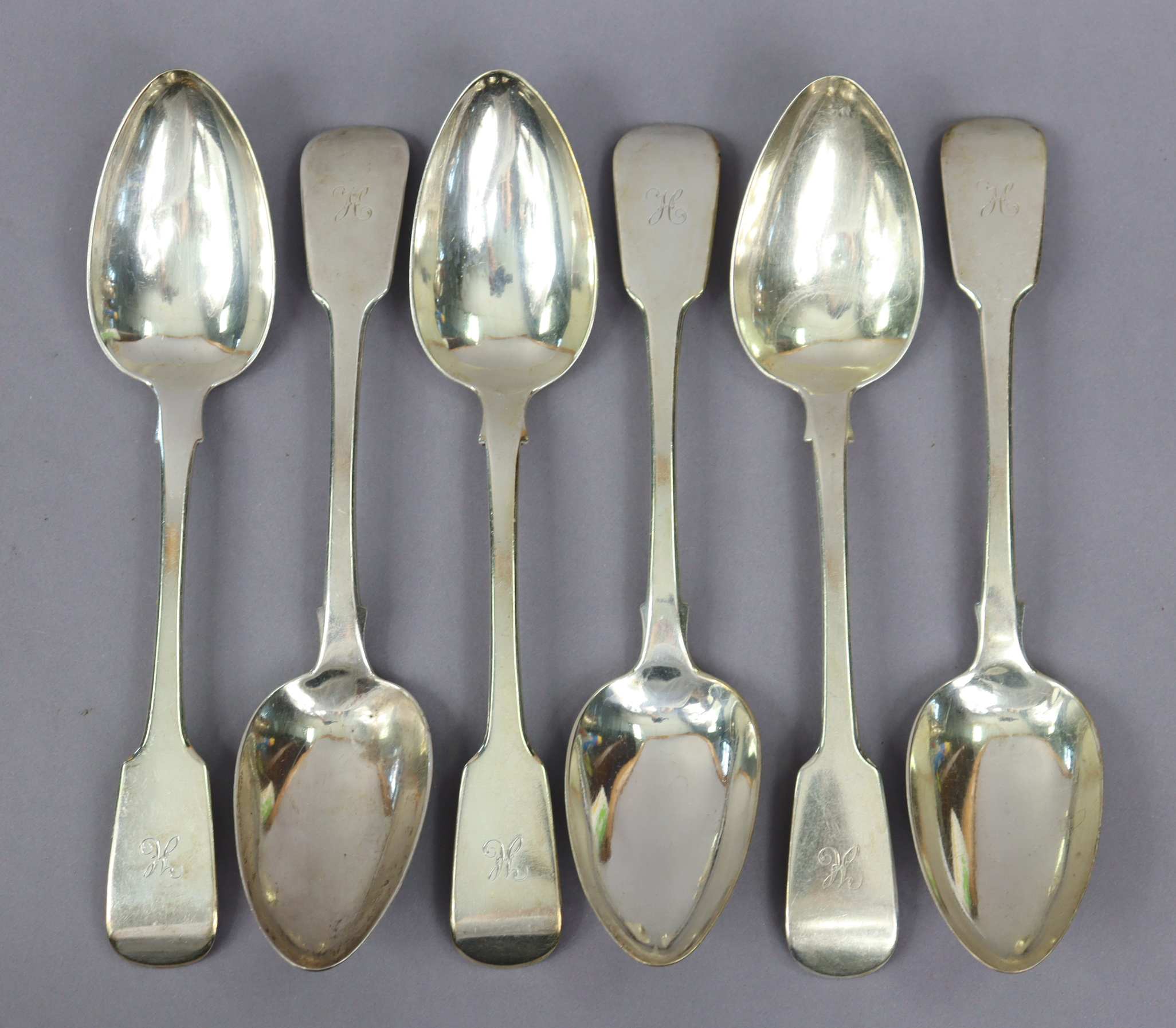 A set of six George IV silver Fiddle pattern tab le spoons, London 1829 by Jonathan Hayne, each with