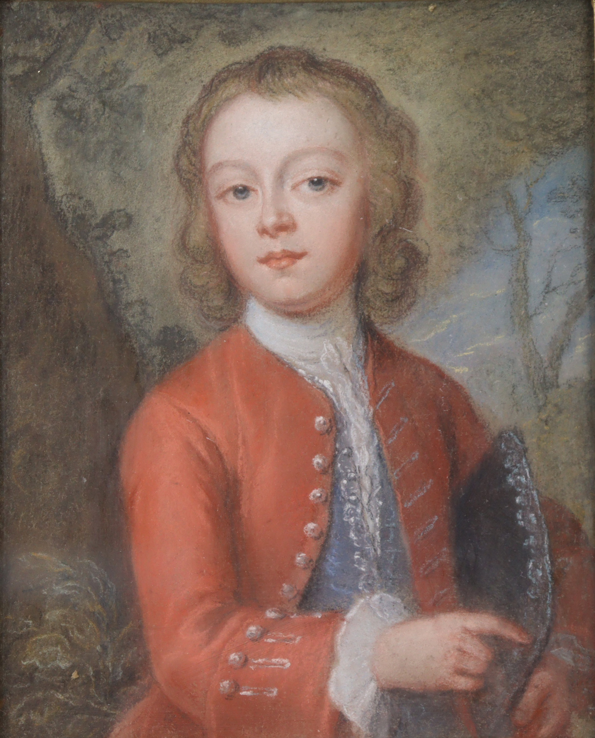 ENGLISH SCHOOL, late 18th century. Portrait of a young man wearing red jacket & holding a hat,