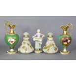 A pair of Rockingham-type porcelain small ewers painted with still life studies of fruit on a