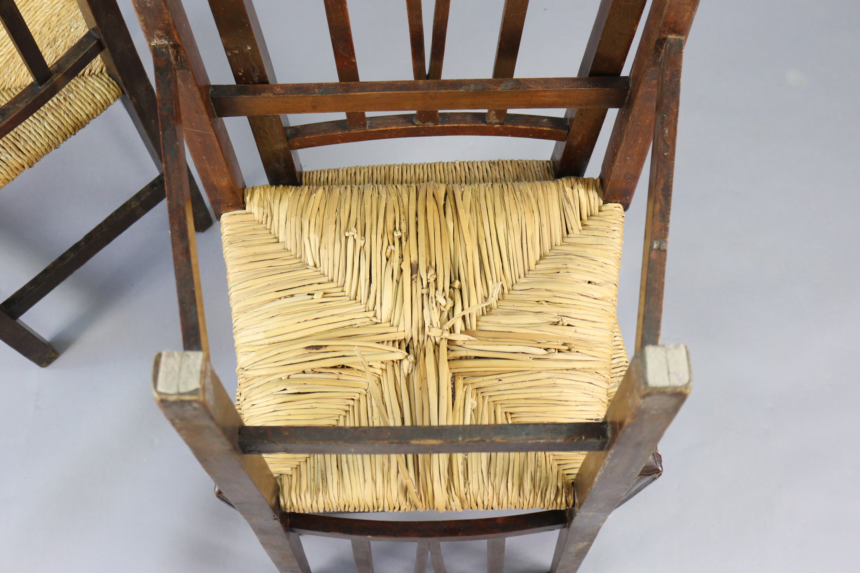 A set of three early 20th century splat-back dining chairs each with a woven-rush seat, & on - Image 10 of 10