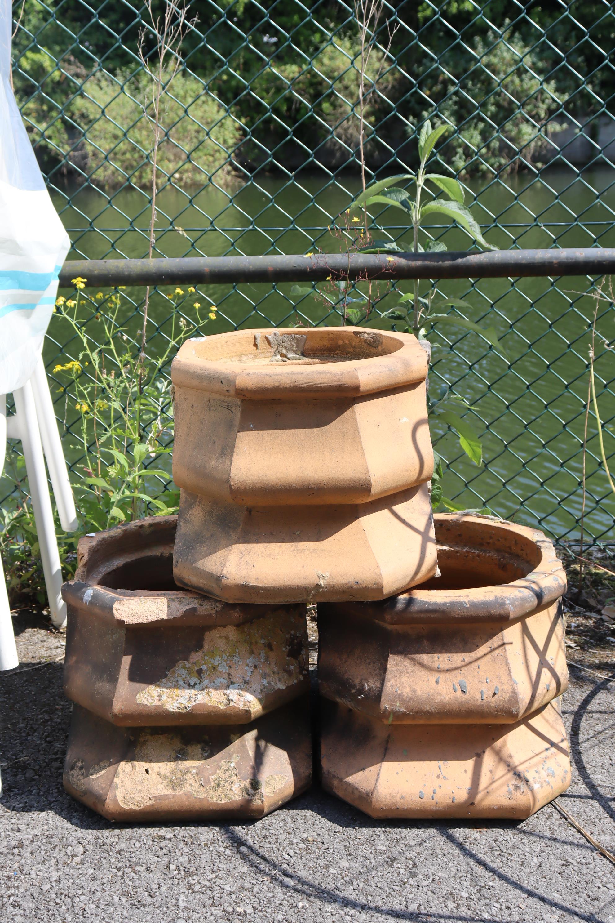 Three terracotta chimney-pot sections each 20” wide x 12½” high; & a set of four white-metal - Image 2 of 4