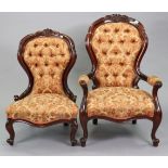 A Victorian-style moulded wooden frame buttoned-back armchair upholstered crimson & bronzed floral