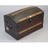 An early 20th century small leatherette-covered oak domed-top travelling trunk with a hinged lift-