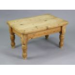 A pine coffee table with rounded corners to the rectangular top, & on four turned legs, 36” wide x