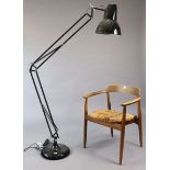 A large black finish anglepoise-type desk lamp.