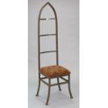 A gothic-style iron frame side chair with a padded seat, & on square legs with plain stretchers.