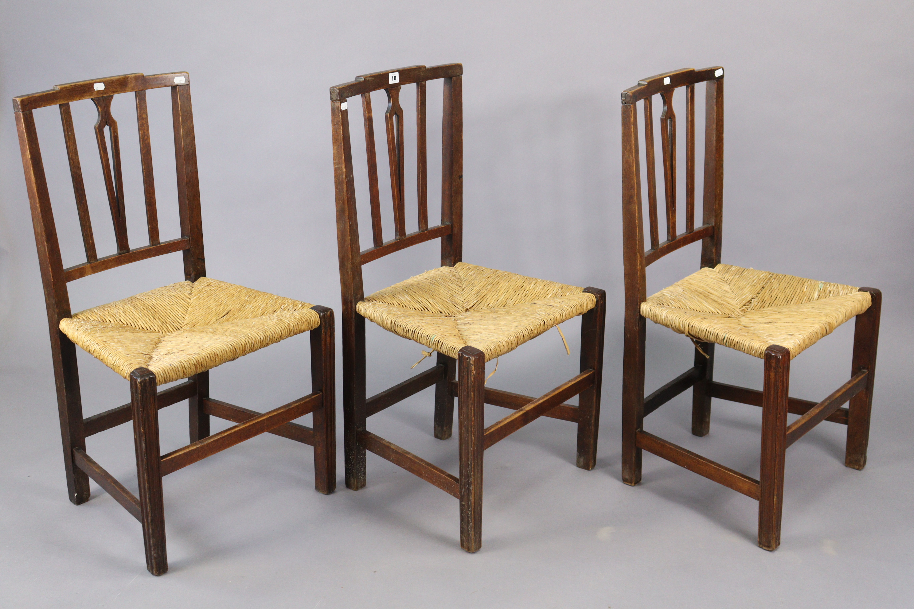 A set of three early 20th century splat-back dining chairs each with a woven-rush seat, & on - Image 8 of 10