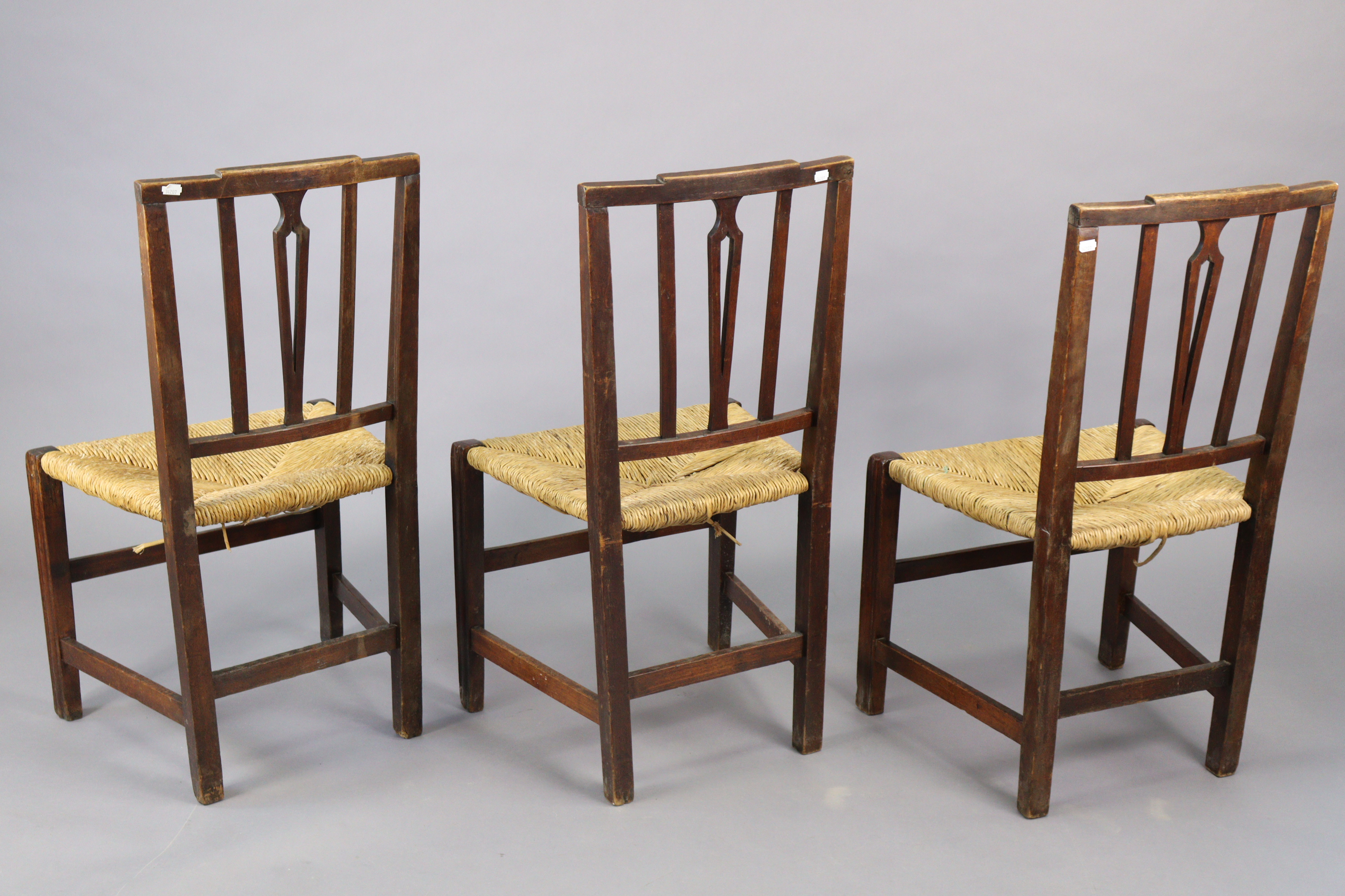 A set of three early 20th century splat-back dining chairs each with a woven-rush seat, & on - Image 9 of 10