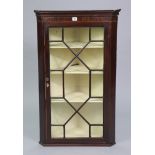 A late 19th/early 20th century inlaid-mahogany small hanging corner cabinet, fitted three shelves