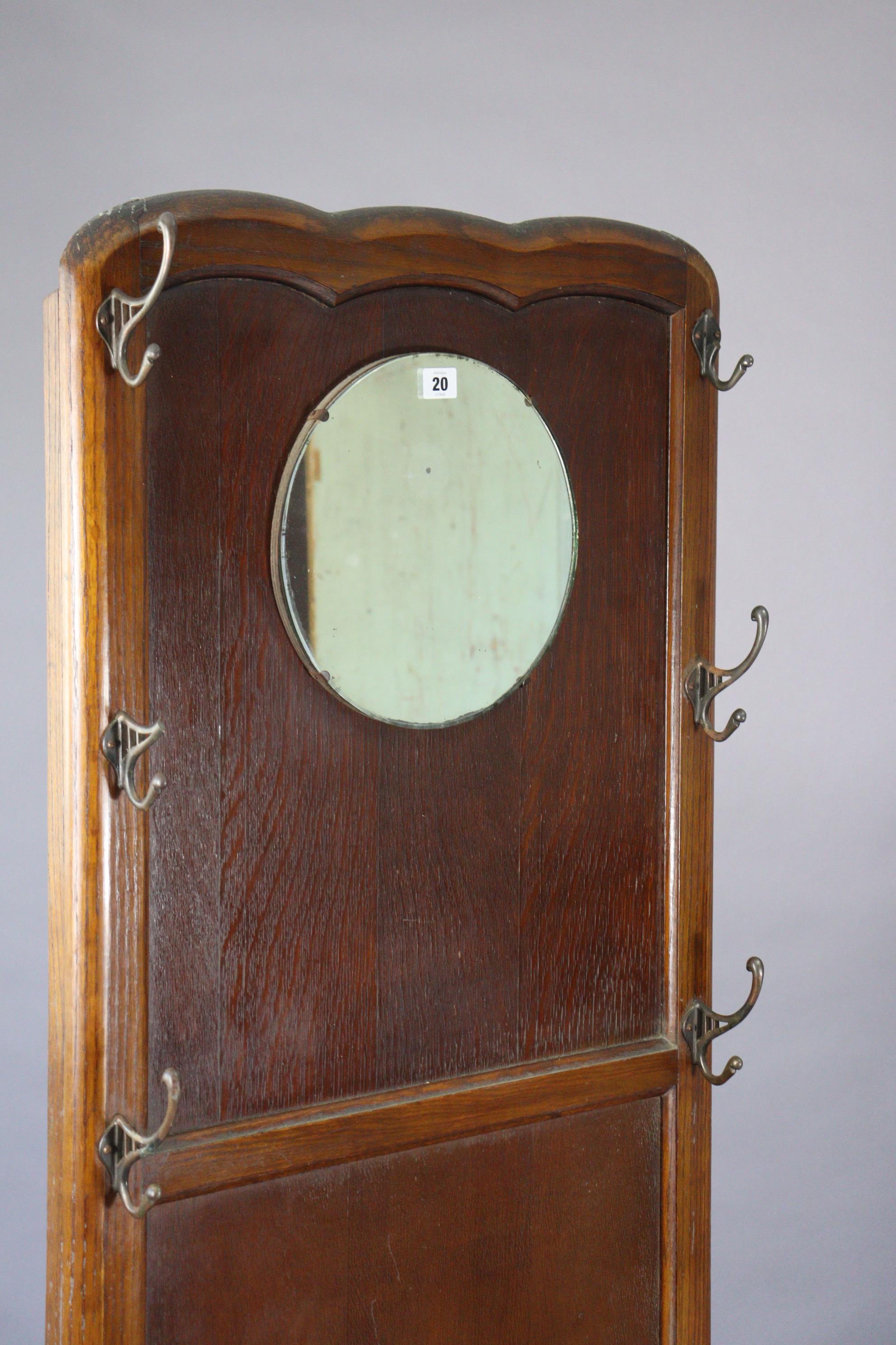 A mid-20th century oak hallstand inset circular mirror to the top, with a boxed hinged seat, & on - Image 2 of 7