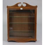 An inlaid-mahogany wall mounted display cabinet having two adjustable plate-glass shelves enclosed