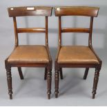 A pair of early 19th century mahogany bow-back dining chairs with padded drop-in-seats, & on