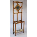 A 1930’s oak hallstand inset mirror to back; & on square legs, 24” wide x 72” high.