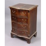 A reproduction mahogany small serpentine-front chest fitted four long drawers, & on bracket feet,