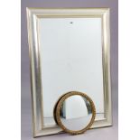 A large rectangular wall mirror in a silvered-finish frame, & inset with a bevelled plate, 40¼” x