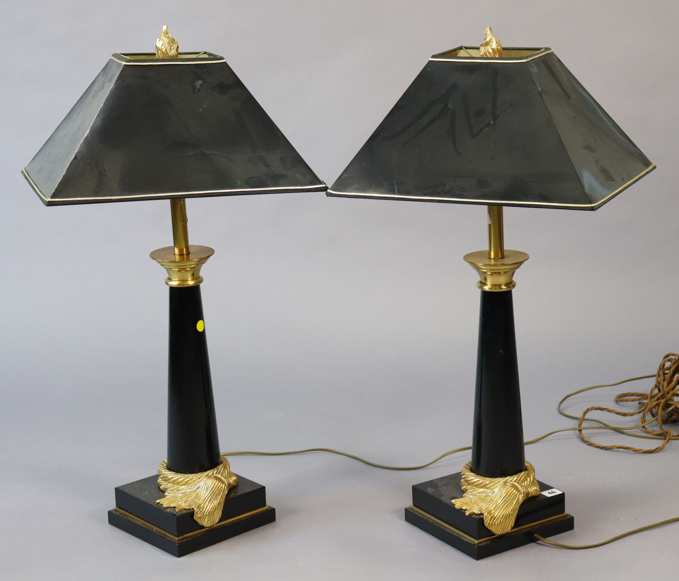 A pair of regency-style black-finish table lamp bases each with gilt-metal mounts, & on square