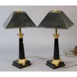 A pair of regency-style black-finish table lamp bases each with gilt-metal mounts, & on square